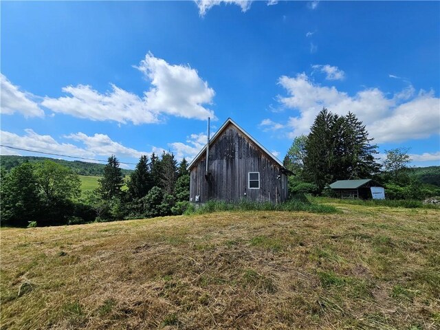 2857 County Route 84, Troupsburg, NY 14885 - view of side of property with an outbuilding