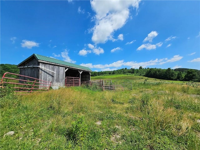 2857 County Route 84, Troupsburg, NY 14885 - view of yard with an outdoor structure, an exterior structure, and a view of countryside