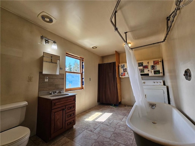 2857 County Route 84, Troupsburg, NY 14885 - bathroom featuring washer / clothes dryer, vanity, stone finish flooring, and shower / tub combo