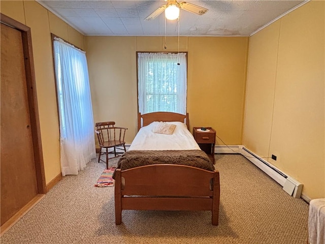 21 Main St, Maryland, NY 12155 - carpeted bedroom with baseboard heating, crown molding, and ceiling fan