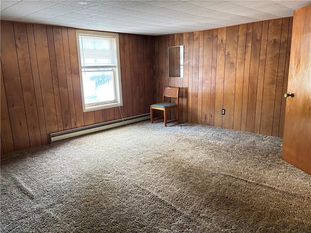 21 Main St, Maryland, NY 12155 - carpeted spare room with a baseboard radiator and wooden walls