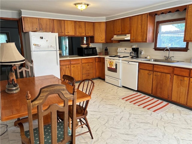 21 Main St, Maryland, NY 12155 - kitchen with white appliances, under cabinet range hood, light marble finish floors, light countertops, and brown cabinets
