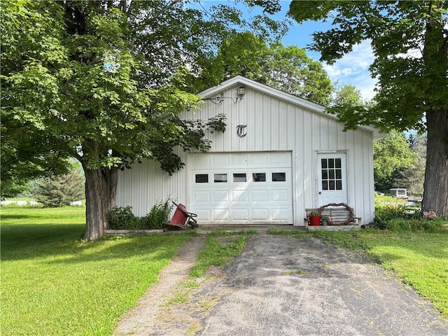 21 Main St, Maryland, NY 12155 - detached garage featuring driveway
