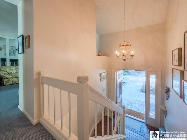 20 Elm Ln Unit E5, Chautauqua, NY 14722 - foyer with high vaulted ceiling, a chandelier, and carpet