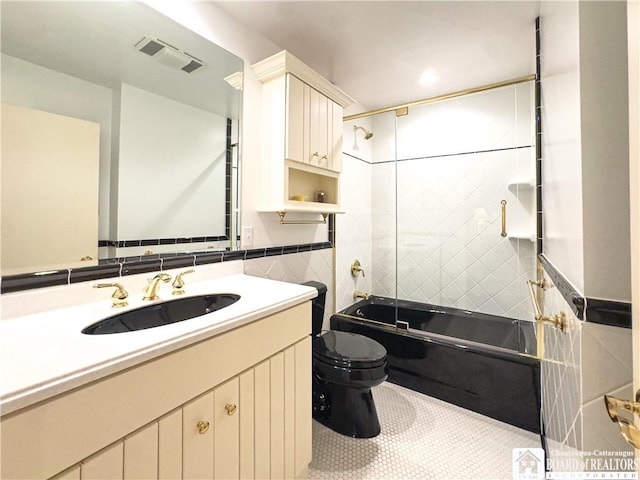20 Elm Ln Unit E5, Chautauqua, NY 14722 - bathroom featuring enclosed tub / shower combo, vanity, tile patterned flooring, and tile walls