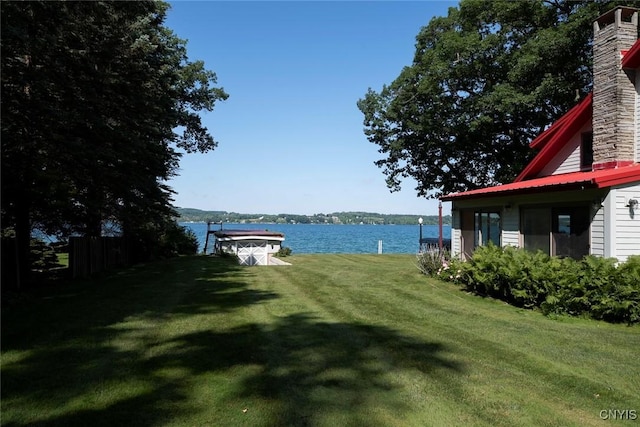 2761 E Lake Rd, Skaneateles, NY 13152 - view of grassy yard featuring a water view and a dock