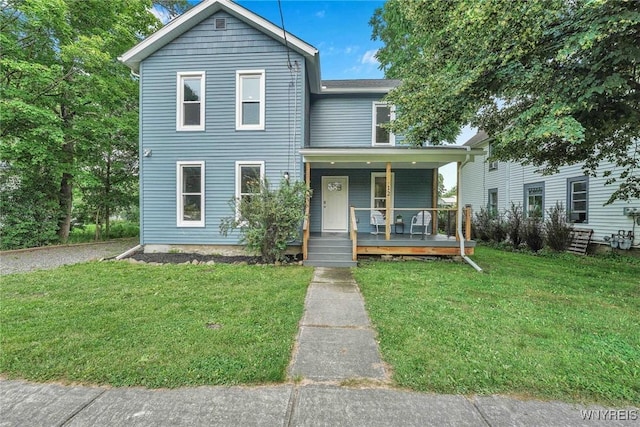12 Clark St, Perry, NY 14530 - traditional-style home featuring covered porch and a front yard