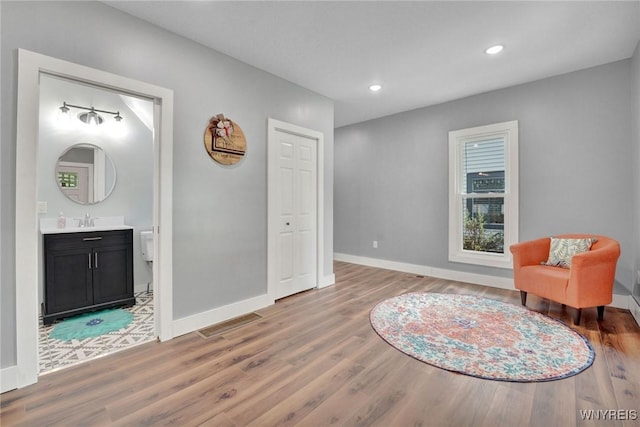 12 Clark St, Perry, NY 14530 - sitting room with wood finished floors and recessed lighting