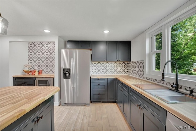 12 Clark St, Perry, NY 14530 - kitchen with stainless steel appliances, butcher block countertops, light wood-style floors, backsplash, and recessed lighting