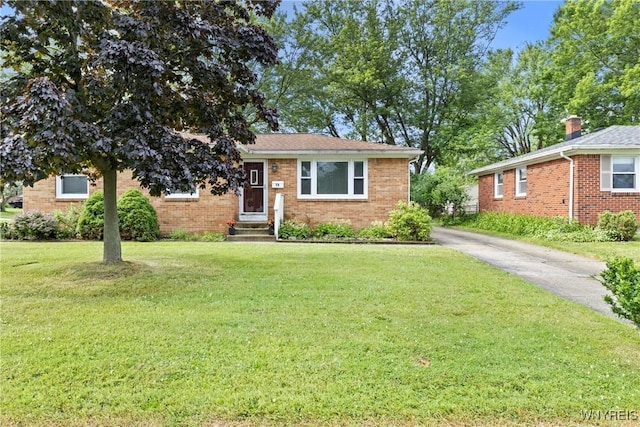 73 Willowcrest Dr, West Seneca, NY 14224 - view of front of home featuring brick siding, a front lawn, entry steps, and driveway