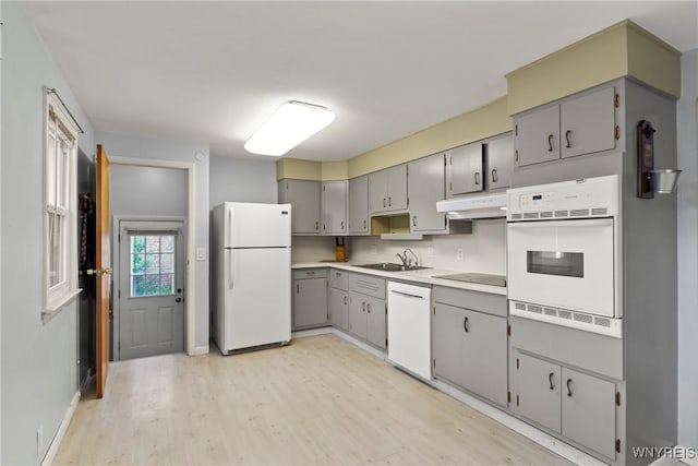 73 Willowcrest Dr, West Seneca, NY 14224 - kitchen featuring white appliances, under cabinet range hood, gray cabinetry, light wood-style floors, and light countertops