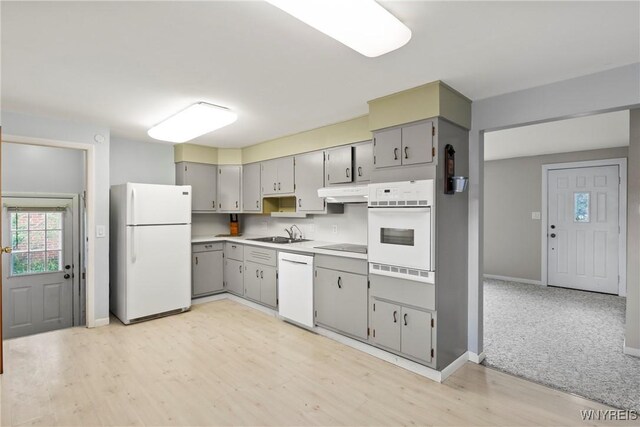 73 Willowcrest Dr, West Seneca, NY 14224 - kitchen featuring white appliances, gray cabinets, under cabinet range hood, light wood-type flooring, and light countertops