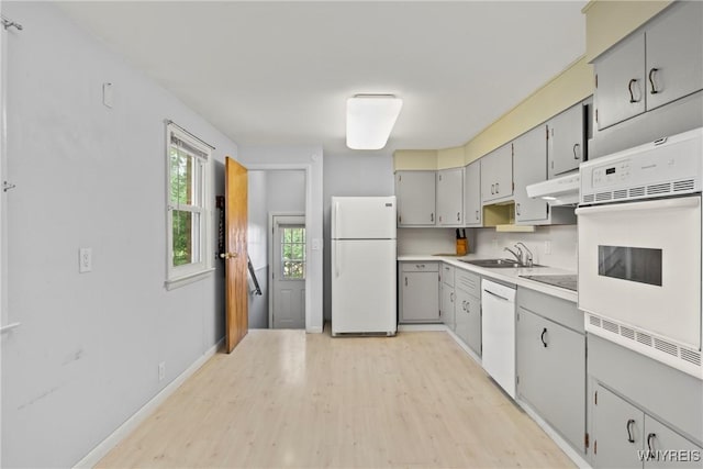 73 Willowcrest Dr, West Seneca, NY 14224 - kitchen with white appliances, light wood-type flooring, light countertops, gray cabinetry, and under cabinet range hood