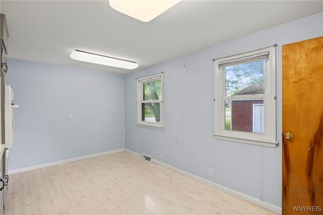73 Willowcrest Dr, West Seneca, NY 14224 - spare room featuring healthy amount of natural light and wood finished floors