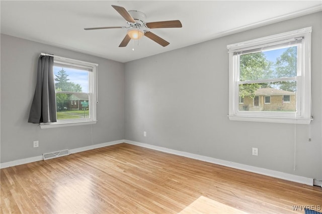 73 Willowcrest Dr, West Seneca, NY 14224 - empty room featuring plenty of natural light, wood finished floors, and ceiling fan