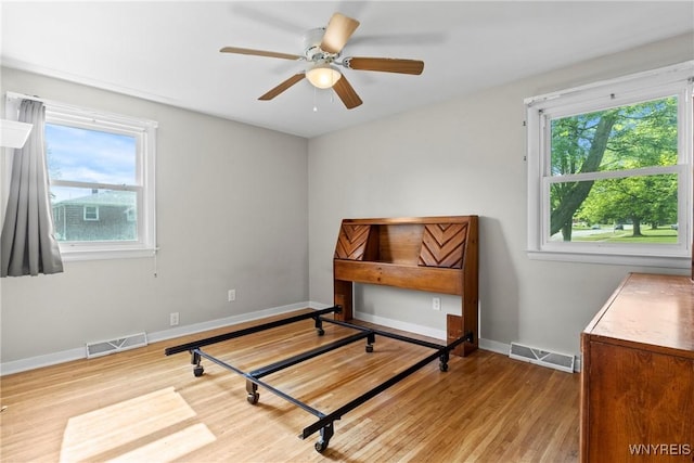 73 Willowcrest Dr, West Seneca, NY 14224 - bedroom featuring multiple windows, wood finished floors, and a ceiling fan