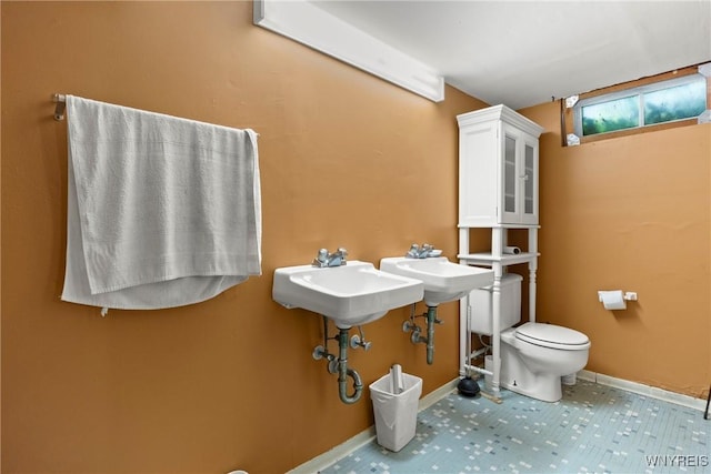 73 Willowcrest Dr, West Seneca, NY 14224 - bathroom featuring toilet and baseboards