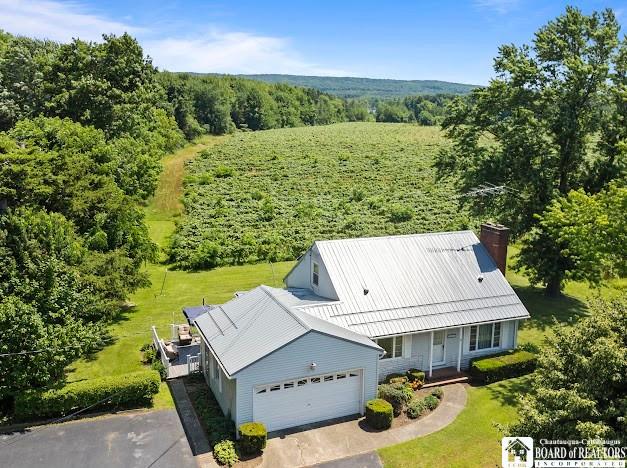 5005 W Main Rd, Pomfret, NY 14063 - view of subject property featuring a heavily wooded area