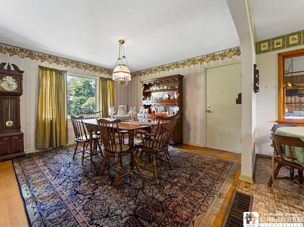 5005 W Main Rd, Pomfret, NY 14063 - dining room featuring wallpapered walls and wood finished floors