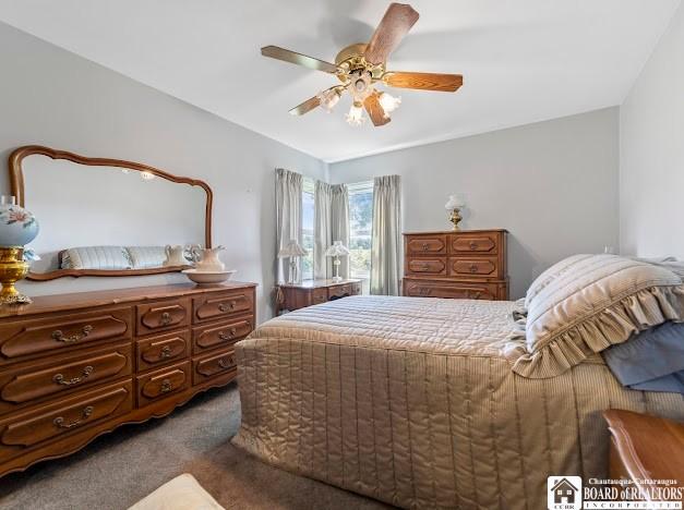 5005 W Main Rd, Pomfret, NY 14063 - bedroom with carpet flooring and a ceiling fan