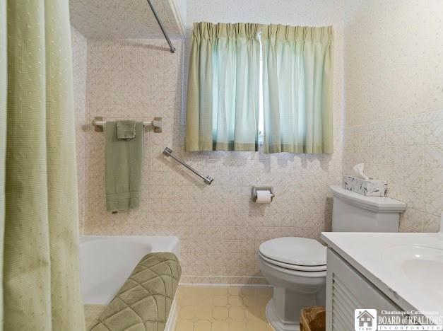 5005 W Main Rd, Pomfret, NY 14063 - full bathroom with tile walls, vanity, and tile patterned floors