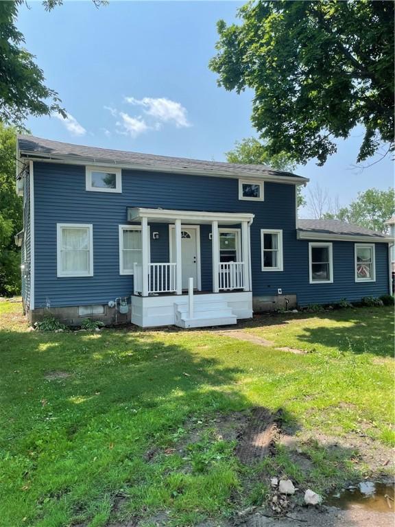 16562 Ridge Rd, Murray, NY 14470 - view of front of house featuring covered porch and a front yard