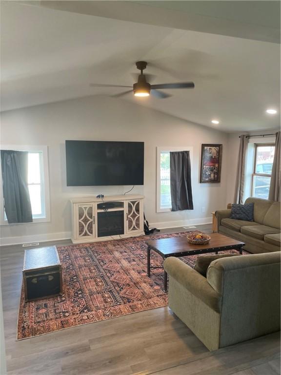 16562 Ridge Rd, Murray, NY 14470 - living room with lofted ceiling, a ceiling fan, plenty of natural light, wood finished floors, and recessed lighting