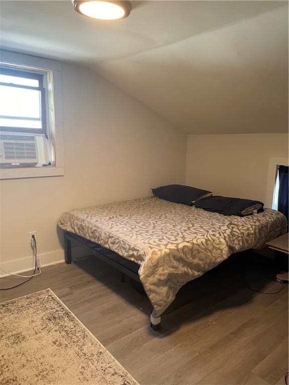 16562 Ridge Rd, Murray, NY 14470 - bedroom featuring light wood-style flooring, lofted ceiling, and cooling unit