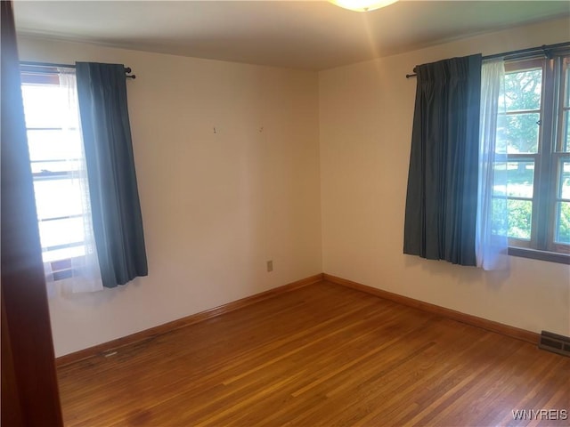 275 Nagel Dr, Cheektowaga, NY 14225 - spare room featuring wood finished floors and plenty of natural light