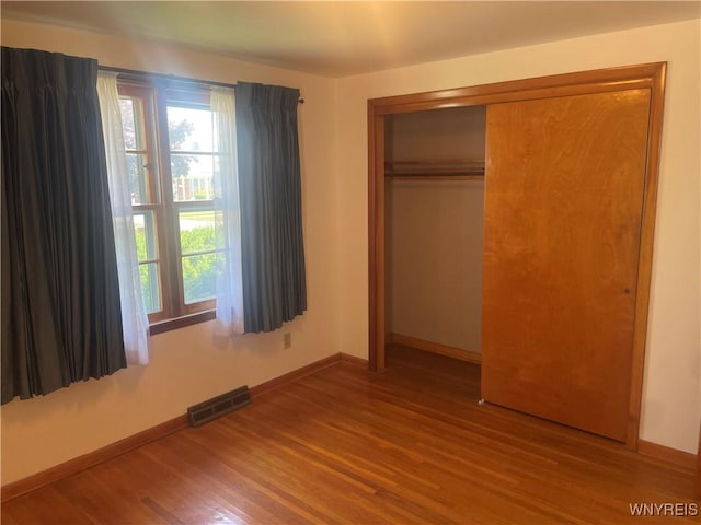 275 Nagel Dr, Cheektowaga, NY 14225 - unfurnished bedroom featuring wood finished floors and a closet