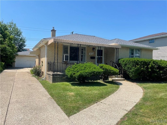 275 Nagel Dr, Cheektowaga, NY 14225 - view of front of property with brick siding, a front lawn, a chimney, and roof with shingles