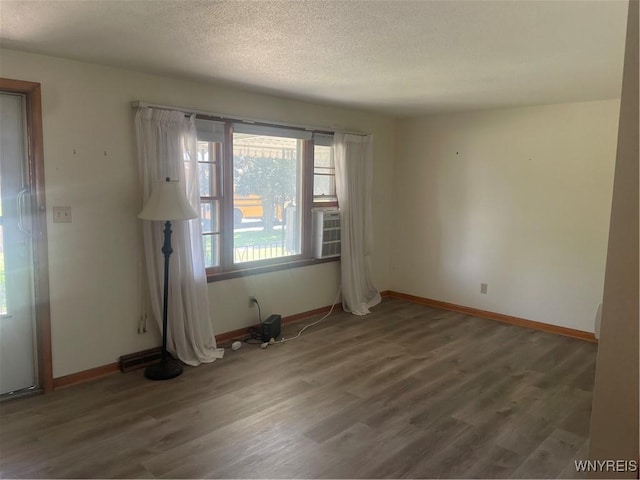 275 Nagel Dr, Cheektowaga, NY 14225 - spare room featuring wood finished floors and a textured ceiling