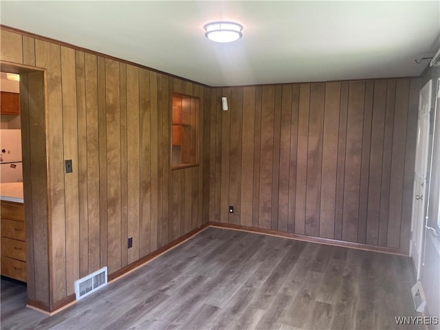 275 Nagel Dr, Cheektowaga, NY 14225 - unfurnished room with wood walls and wood finished floors