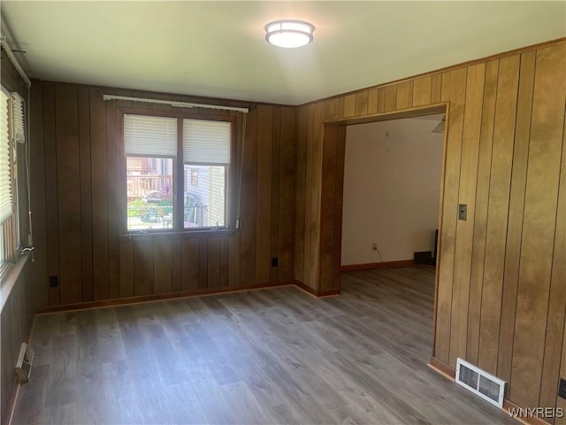 275 Nagel Dr, Cheektowaga, NY 14225 - unfurnished room featuring light wood-style floors and wooden walls