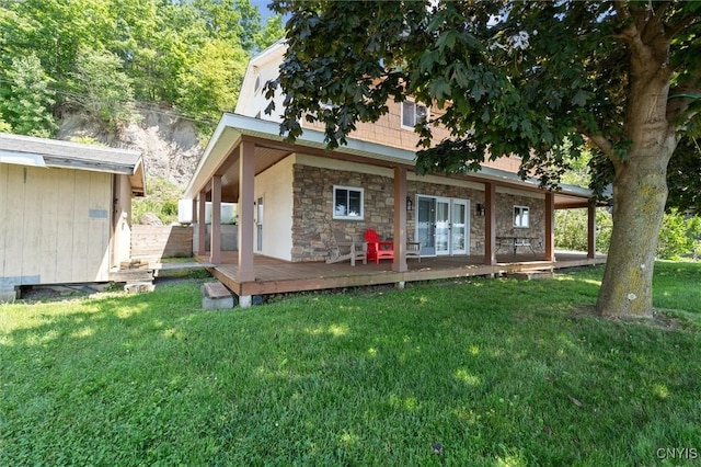 1659 Honoco Rd, Ledyard, NY 13026 - rear view of property featuring a lawn, a wooden deck, and stone siding
