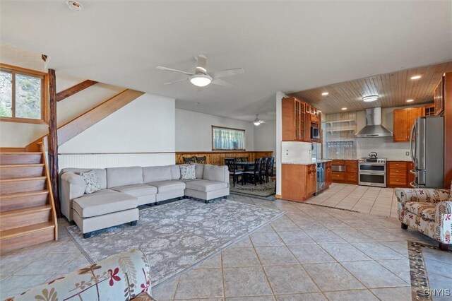 1659 Honoco Rd, Ledyard, NY 13026 - living room with ceiling fan, light tile patterned flooring, and stairs