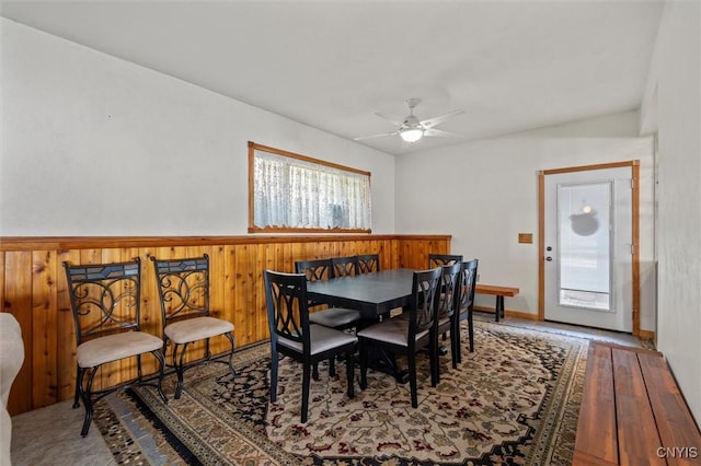 1659 Honoco Rd, Ledyard, NY 13026 - dining space with ceiling fan, wood finished floors, and wainscoting