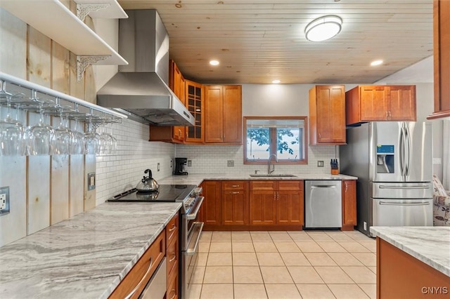 1659 Honoco Rd, Ledyard, NY 13026 - kitchen with appliances with stainless steel finishes, wall chimney exhaust hood, decorative backsplash, light tile patterned floors, and recessed lighting