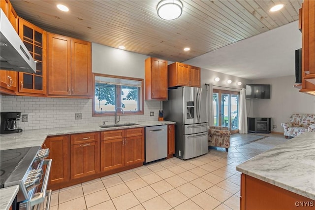 1659 Honoco Rd, Ledyard, NY 13026 - kitchen with stainless steel appliances, ventilation hood, tasteful backsplash, light stone countertops, and recessed lighting