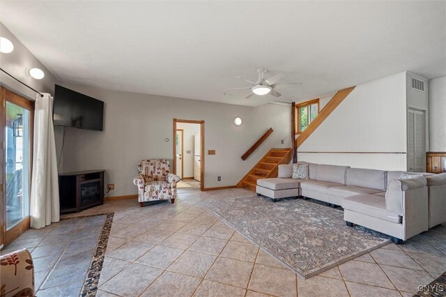 1659 Honoco Rd, Ledyard, NY 13026 - living area featuring stairway, a ceiling fan, and light tile patterned flooring
