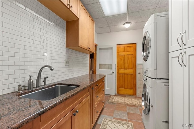 1659 Honoco Rd, Ledyard, NY 13026 - laundry area with stacked washing machine and dryer and cabinet space