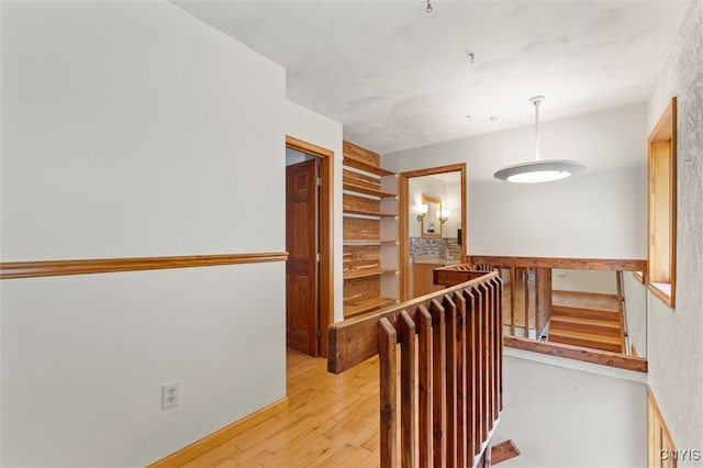 1659 Honoco Rd, Ledyard, NY 13026 - corridor featuring an upstairs landing and light wood finished floors