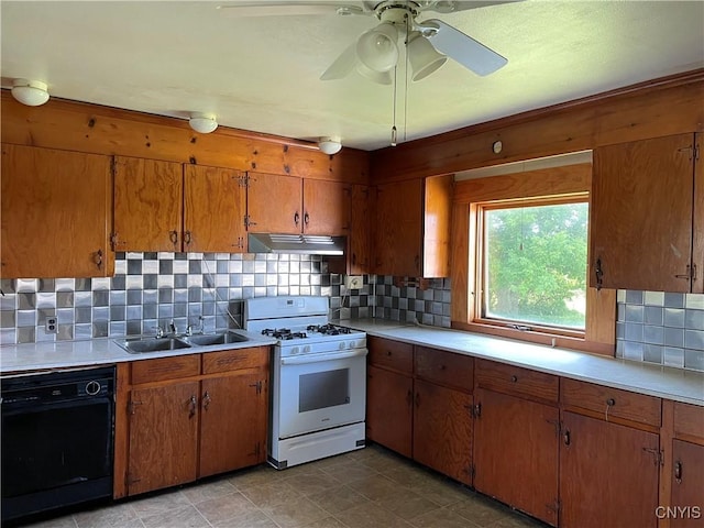 17106 State Route 3, Hounsfield, NY 13601 - kitchen featuring white range with gas stovetop, dishwasher, light countertops, and brown cabinetry