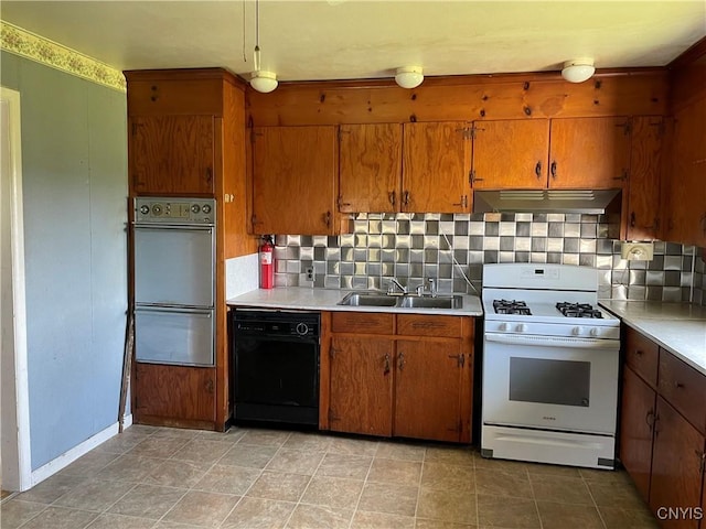 17106 State Route 3, Hounsfield, NY 13601 - kitchen featuring white range with gas stovetop, black dishwasher, ventilation hood, brown cabinetry, and light countertops