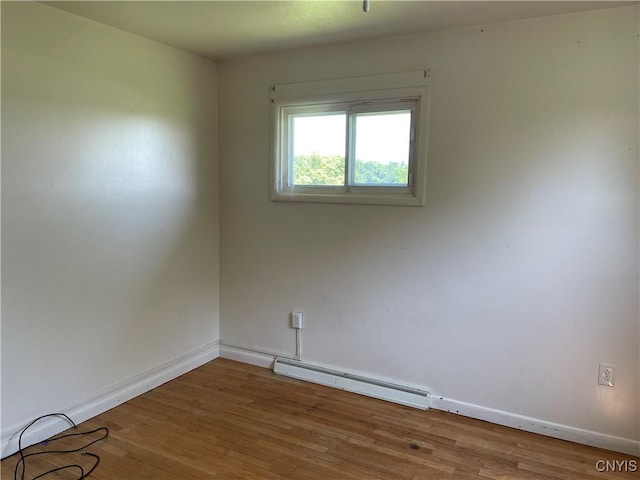 17106 State Route 3, Hounsfield, NY 13601 - unfurnished room with a baseboard heating unit and wood finished floors