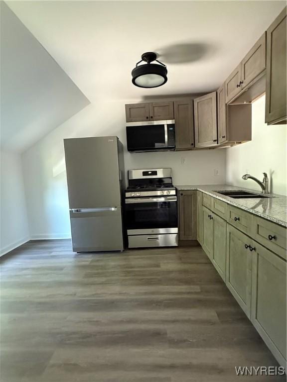 2656 Oakwood Ave, Hamburg, NY 14075 - kitchen featuring stainless steel appliances, wood finished floors, and light stone countertops