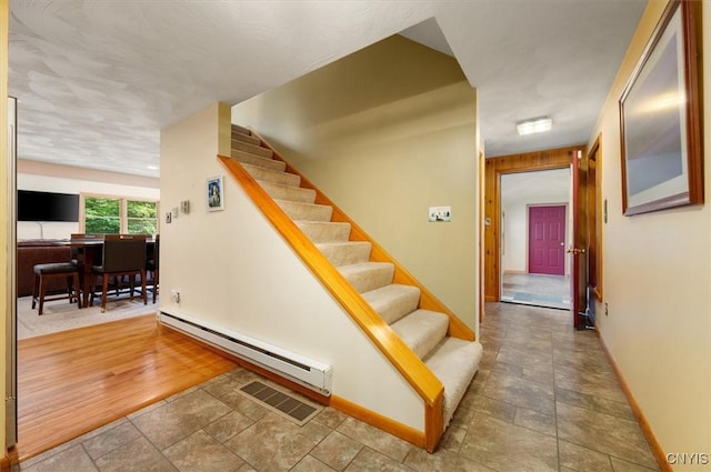 4970 State Route 8, Ohio, NY 13324 - stairs with baseboard heating and stone finish flooring