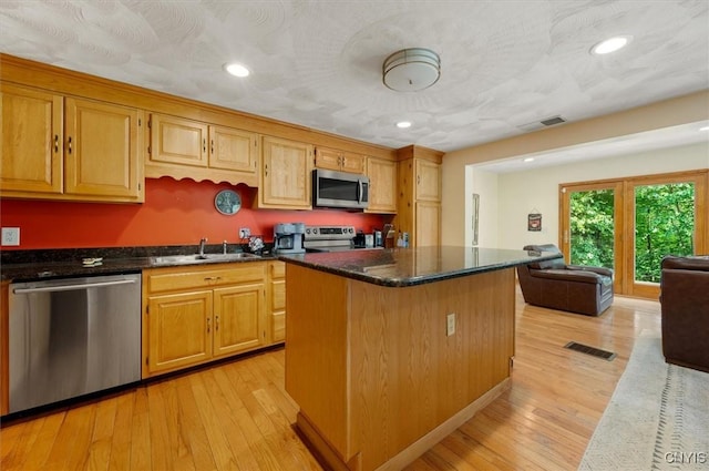 4970 State Route 8, Ohio, NY 13324 - kitchen featuring stainless steel appliances, light wood finished floors, a kitchen island, recessed lighting, and open floor plan