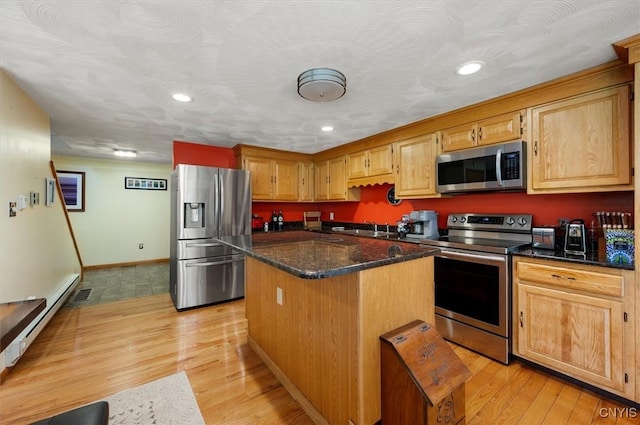 4970 State Route 8, Ohio, NY 13324 - kitchen featuring appliances with stainless steel finishes, a kitchen island, recessed lighting, light wood finished floors, and a baseboard radiator