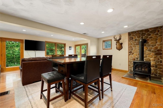 4970 State Route 8, Ohio, NY 13324 - dining room with light wood-type flooring, a wood stove, and recessed lighting